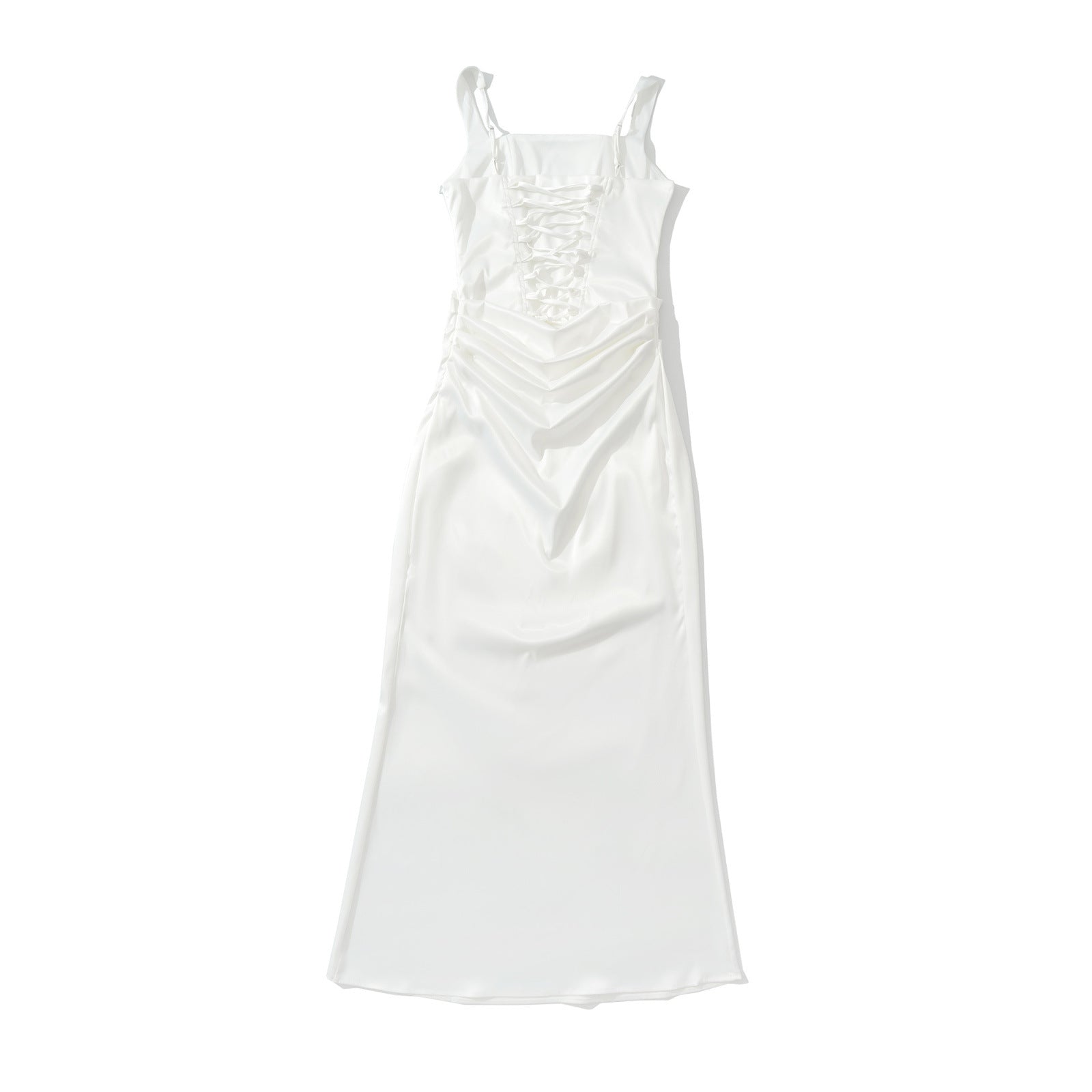 Woman wearing backless camisole dress in a summer setting