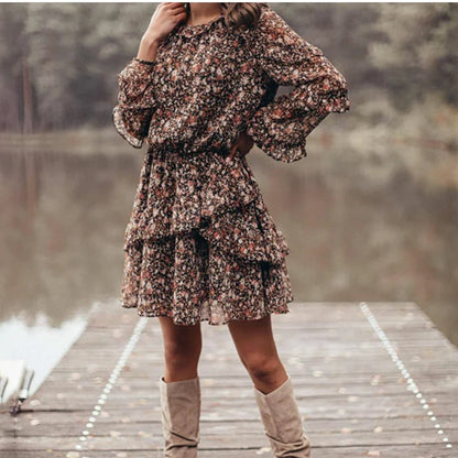Woman wearing Floral Print Ruffle Sleeve Midi Dress in a garden setting