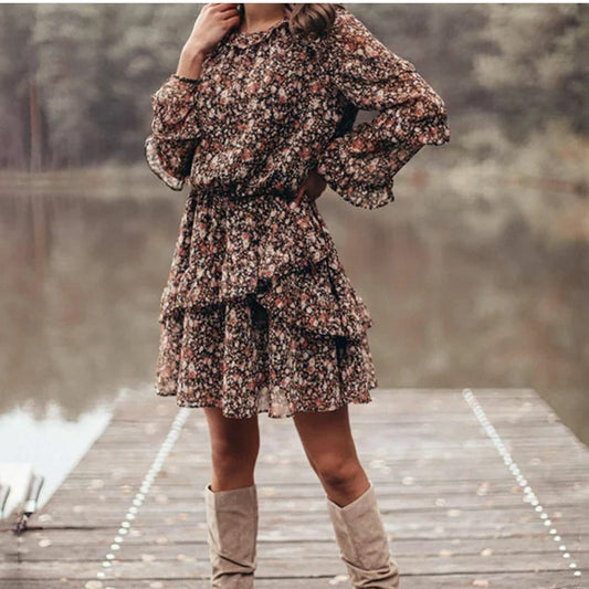Woman wearing Floral Print Ruffle Sleeve Midi Dress in a garden setting