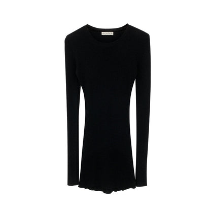 Woman wearing Slim Fit Wool Blend Long Sleeve Sweater in a cozy setting