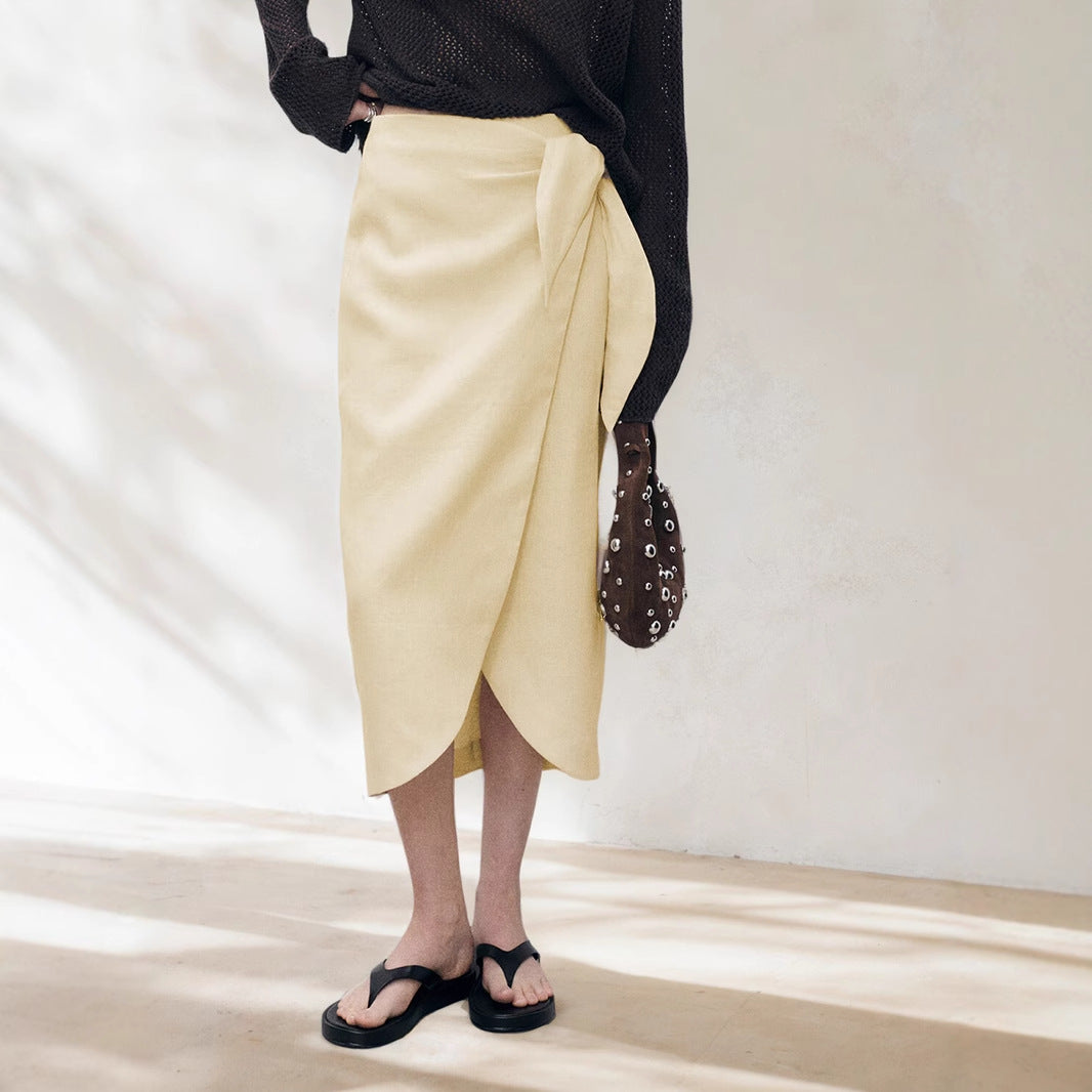Woman wearing Solid Color Irregular Skirt in a stylish setting