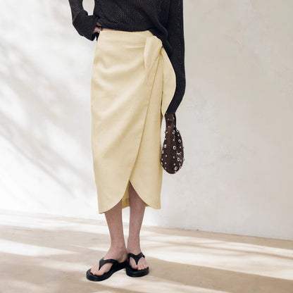 Woman wearing Solid Color Irregular Skirt in a stylish setting
