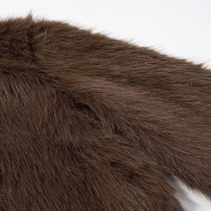 Woman wearing High Neck Long Sleeve Loose Fit Faux Fur Coat in a winter setting