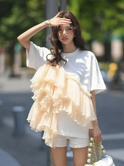 Woman wearing Cotton Mesh Patchwork Loose O Neck Short Sleeve T Shirt in a casual setting
