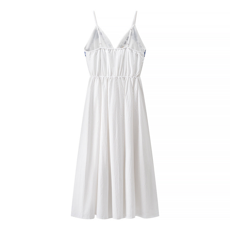 Woman wearing Embroidered Strapless Midi Dress in a sunny garden