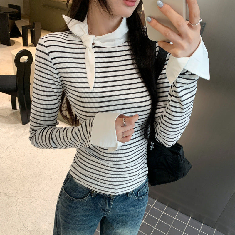 Woman wearing Women's Stripe Mock Neck Tie-Front Top in a stylish setting
