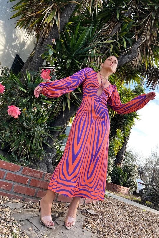 Woman wearing Irregular Stripe Printed Long Dress in a stylish urban setting