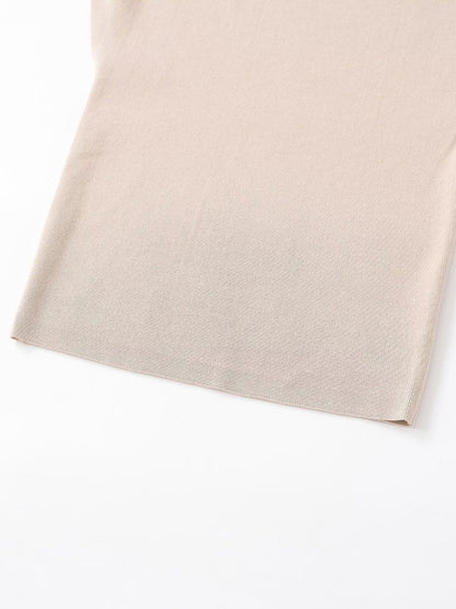 Woman wearing Asymmetric Knitted Top in a casual setting