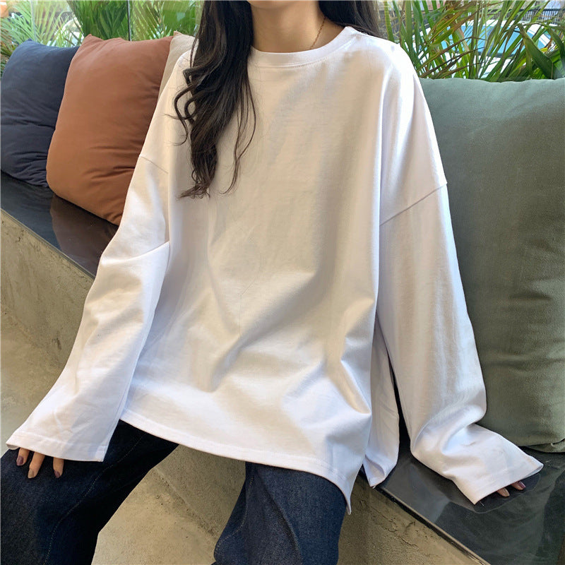 Woman wearing Split Color Long Sleeve T Shirt in a casual setting