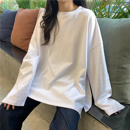 Woman wearing Split Color Long Sleeve T Shirt in a casual setting