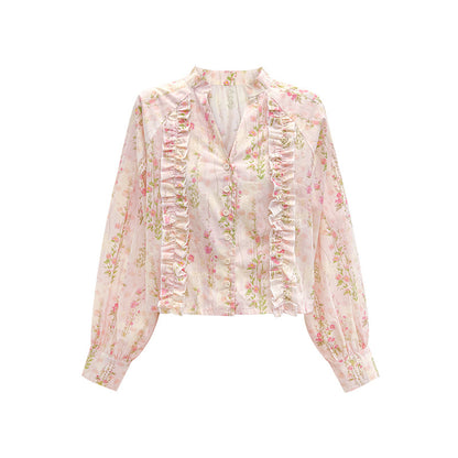 Woman wearing Floral Long Sleeve Shirt in a sunny outdoor setting