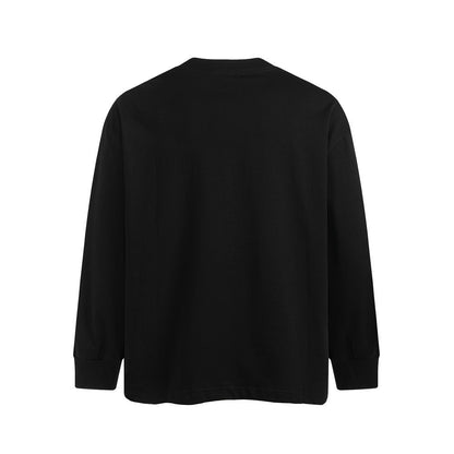 Woman wearing Letter Print Long Sleeve Loose Fit Cotton Shirt in a casual outdoor setting