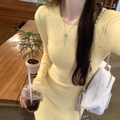 Woman wearing Slim Fit Wool Blend Long Sleeve Sweater in a cozy setting
