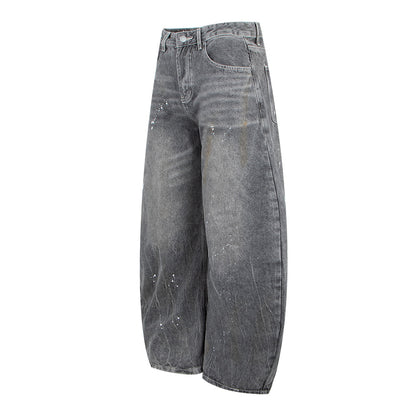 Woman wearing Vintage Washed Gray Splatter Wide Leg Jeans in an urban setting