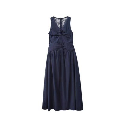 Woman wearing Sleeveless Vest Dress with Floral Detail in a sunny garden