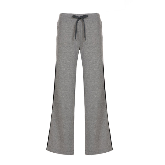 Woman wearing casual loose pants in a relaxed setting