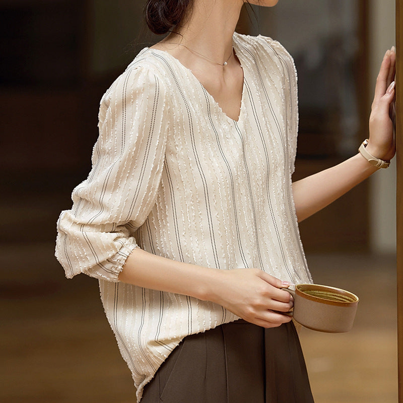 Woman wearing Elegant Textured Collar Shirt in urban setting