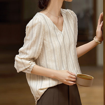 Woman wearing Elegant Textured Collar Shirt in urban setting
