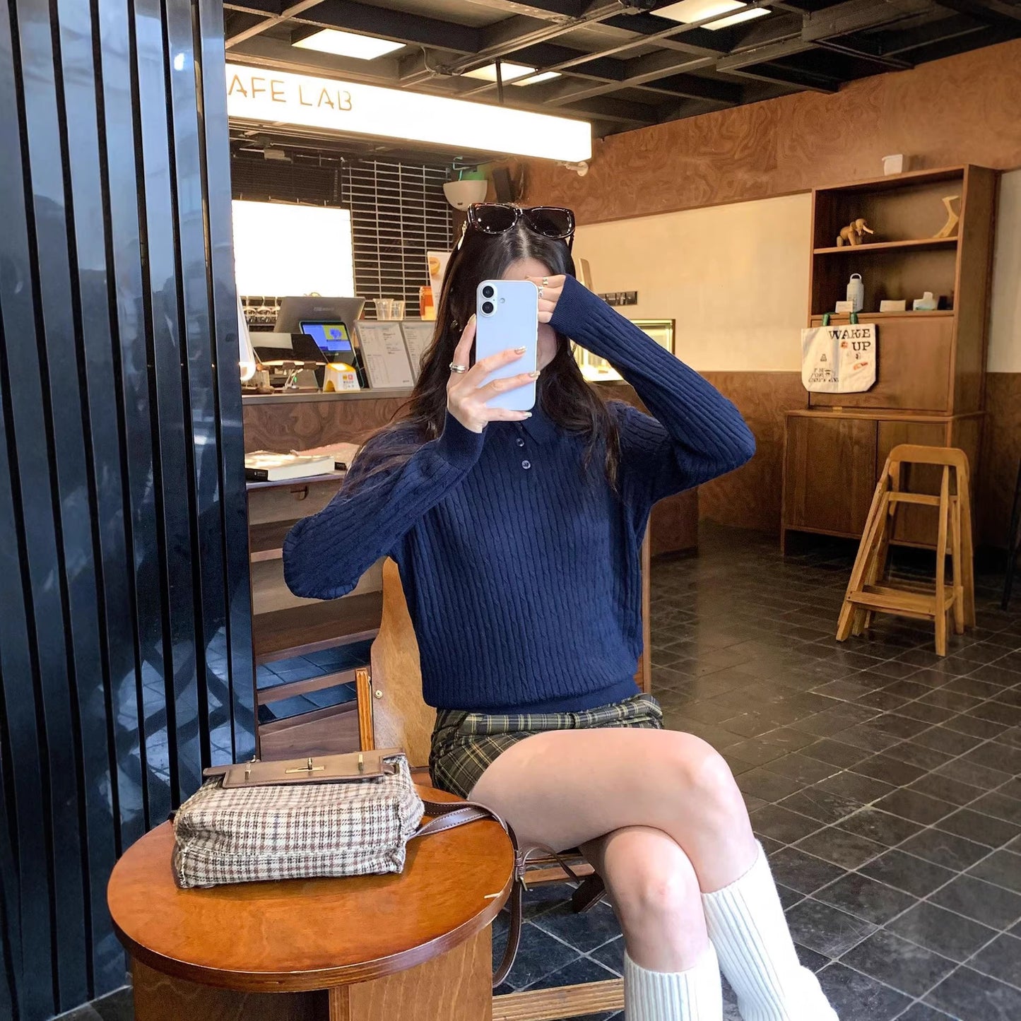 Woman wearing Slim Fit Long Sleeve Knit Sweater in a casual setting