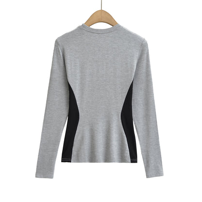 Woman wearing Elastic Slim Fit Color Block Long Sleeve T-Shirt in a casual setting