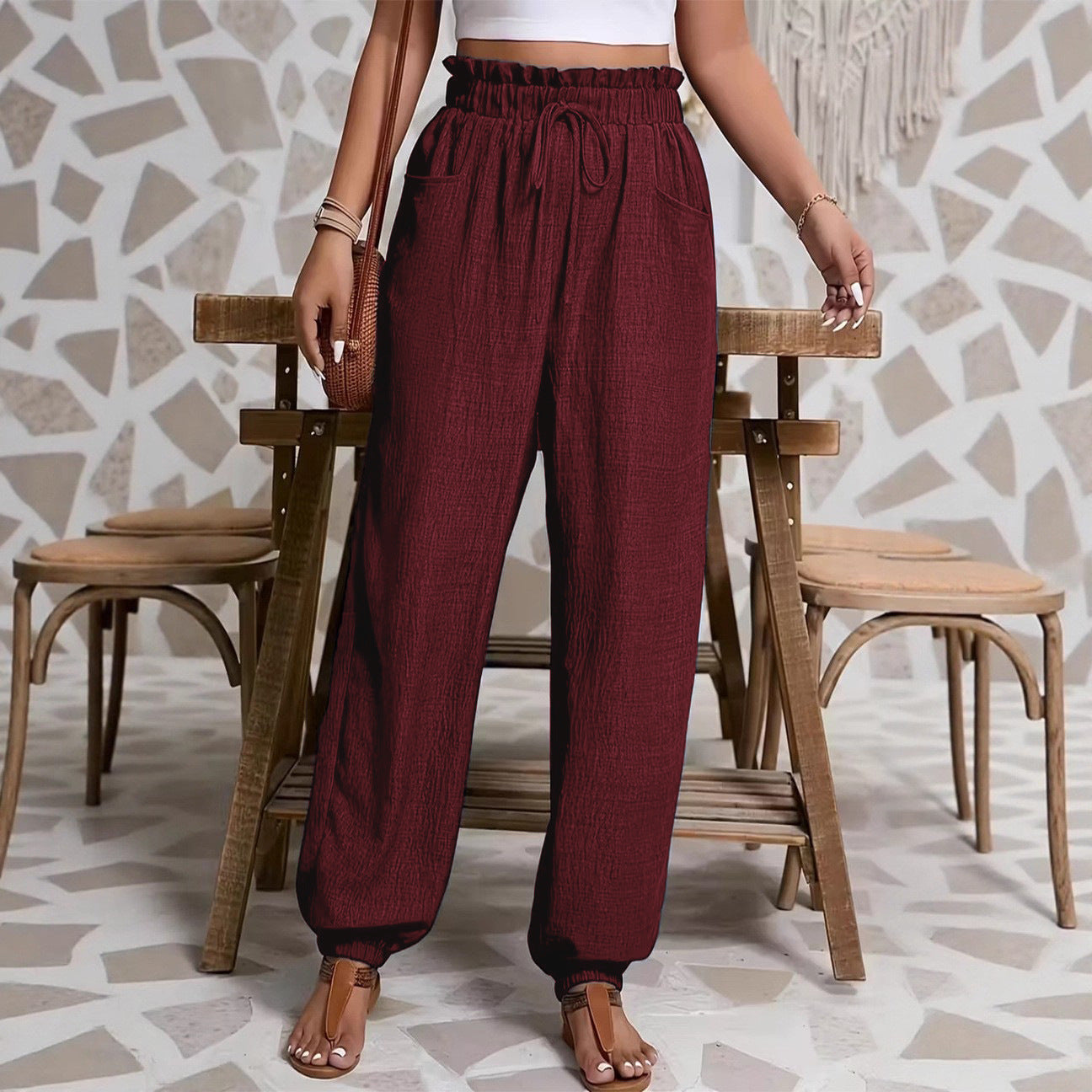 Woman wearing Elastic Solid Color Pants in a casual setting