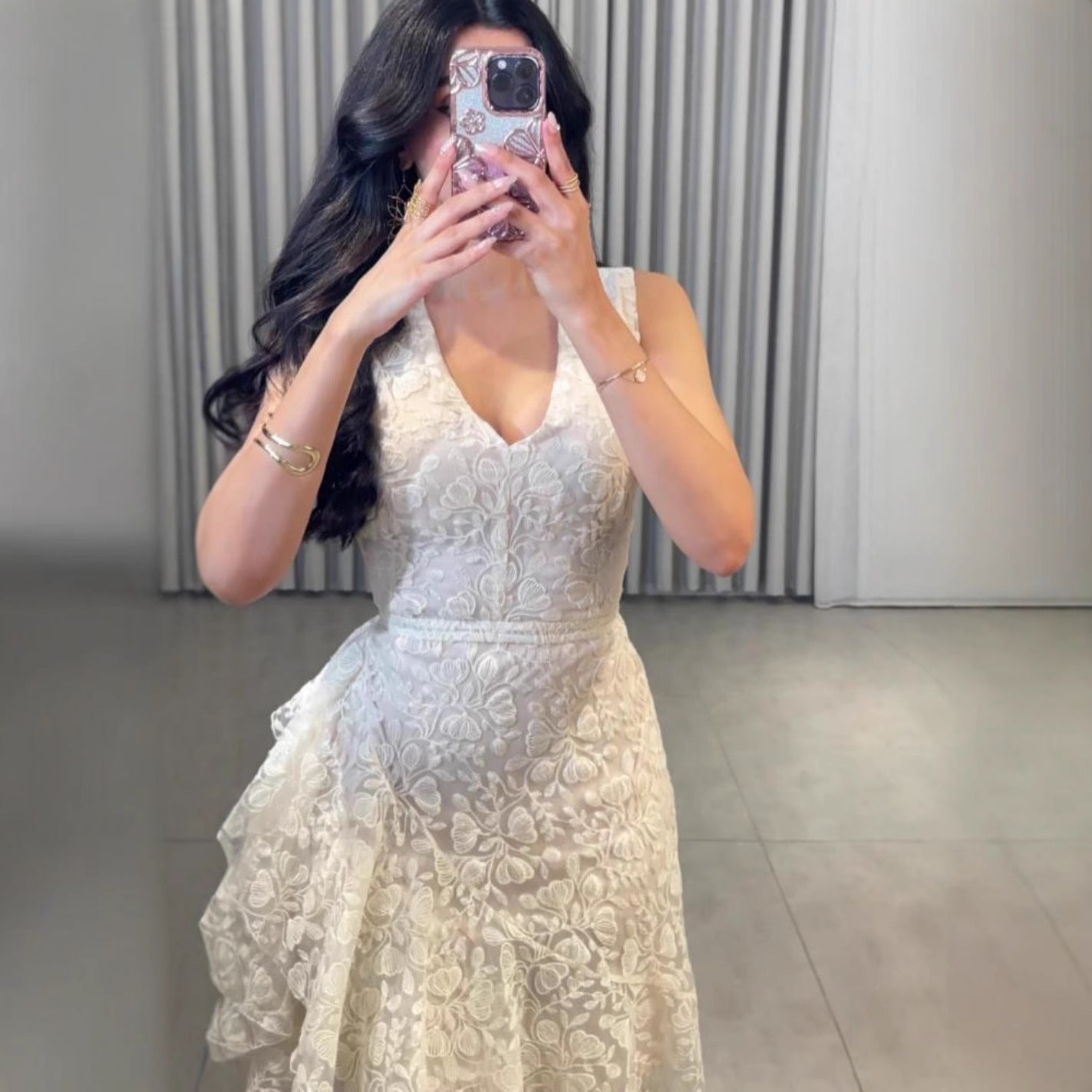 Woman wearing Asymmetric Jacquard Dress in an elegant setting