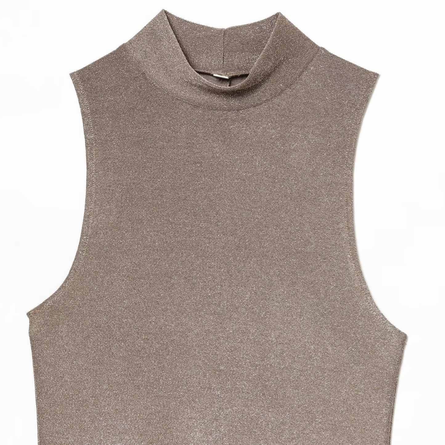 Woman wearing metallic sleeveless dress in a casual setting