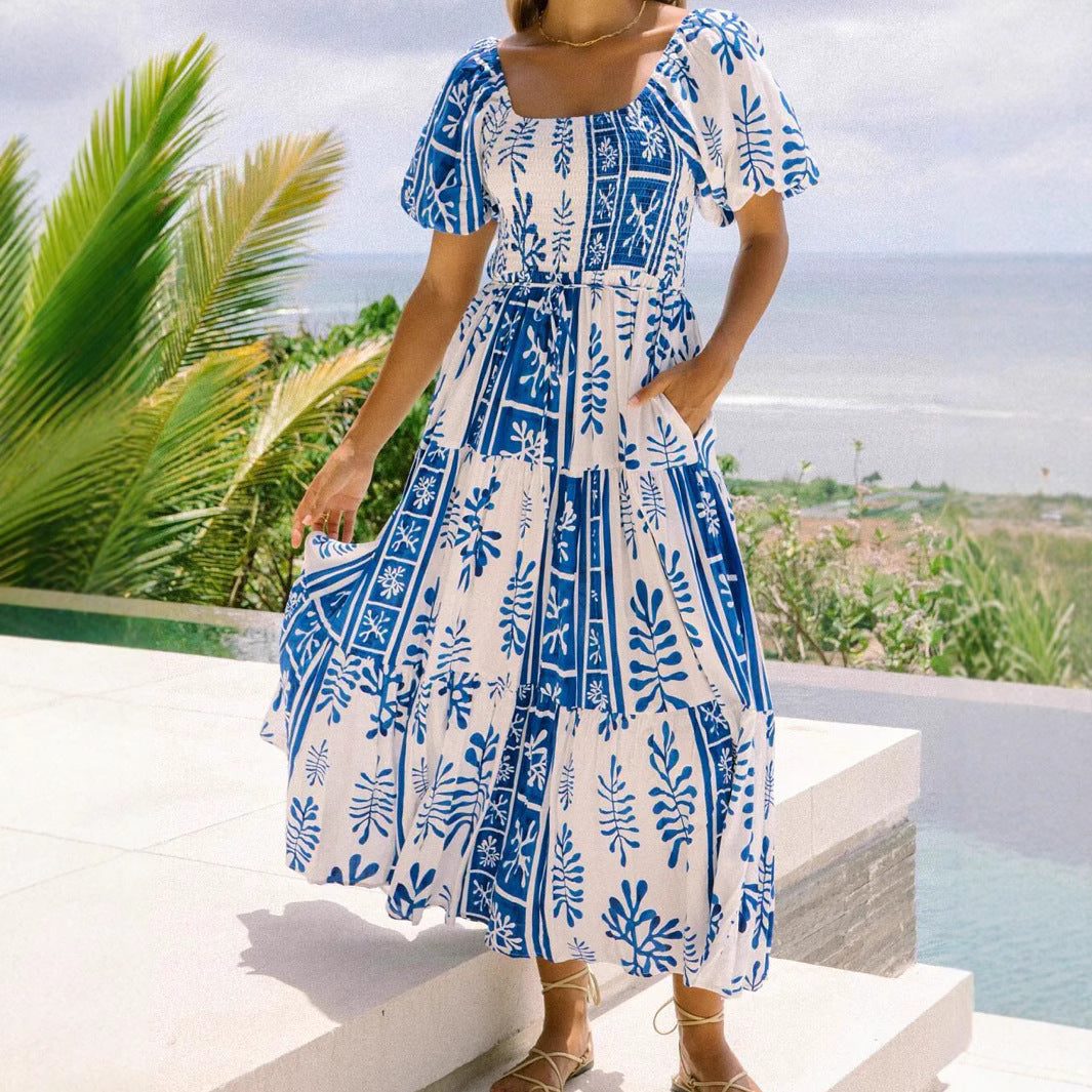 Woman wearing One-Shoulder Puff Sleeve Flared Maxi Dress in a garden setting