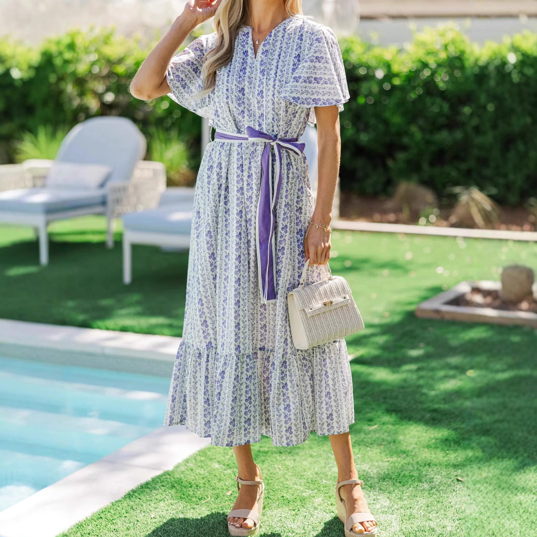 Woman wearing Bohemian Floral Ruffle Maxi Dress in a garden