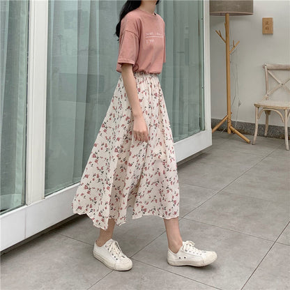 Woman wearing Floral Bohemian A-Line Midi Skirt in a sunny park