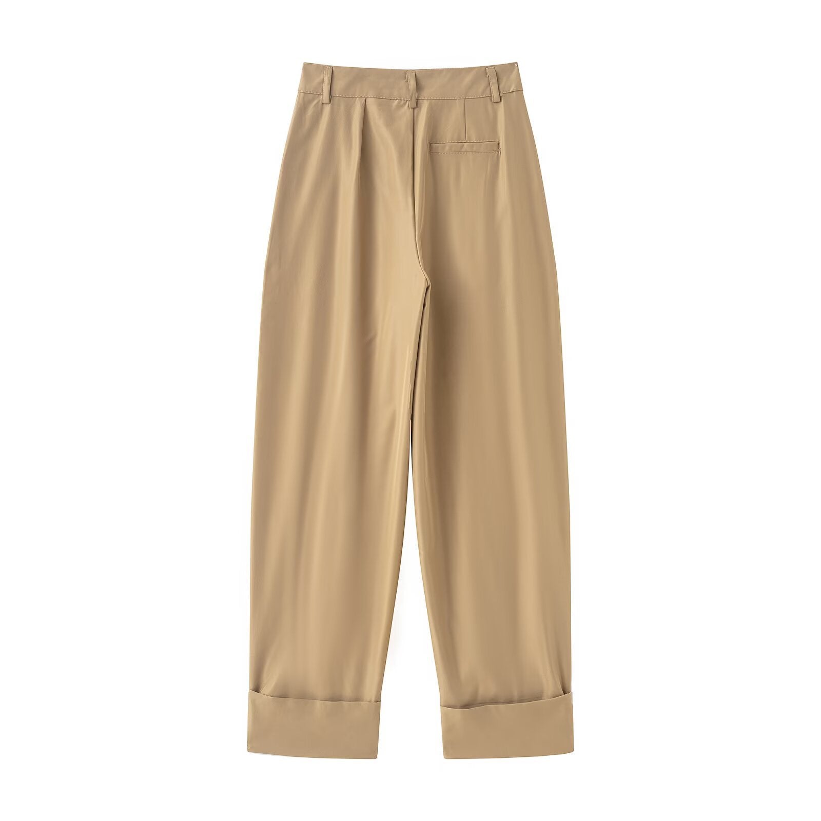 Woman wearing versatile pleated casual pants in a stylish urban setting