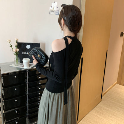 Woman wearing Lace Up Butterfly Long Sleeve Top in a casual setting
