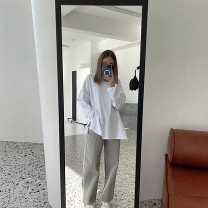 Woman wearing Loose Fit Long Sleeve Slit T-Shirt in a casual setting