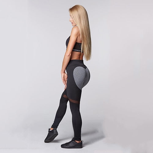 Woman wearing Sexy Heart Yoga Pants in a yoga studio