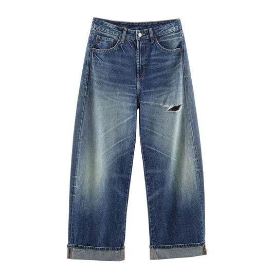 Woman wearing Mid Rise Loose Ripped Jeans in a casual setting