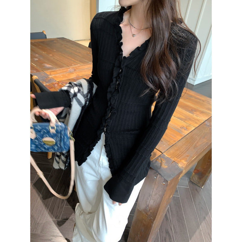 Woman wearing Ruffled V-Neck Slim Fit Cardigan in a stylish setting