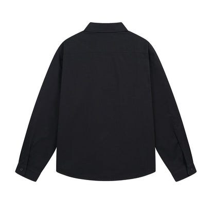 Woman wearing Logo Letter Printed Long Sleeve Shirt in a casual setting