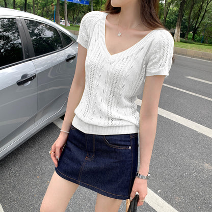 Woman wearing V-Neck Hollow Knit Top in a stylish outdoor setting
