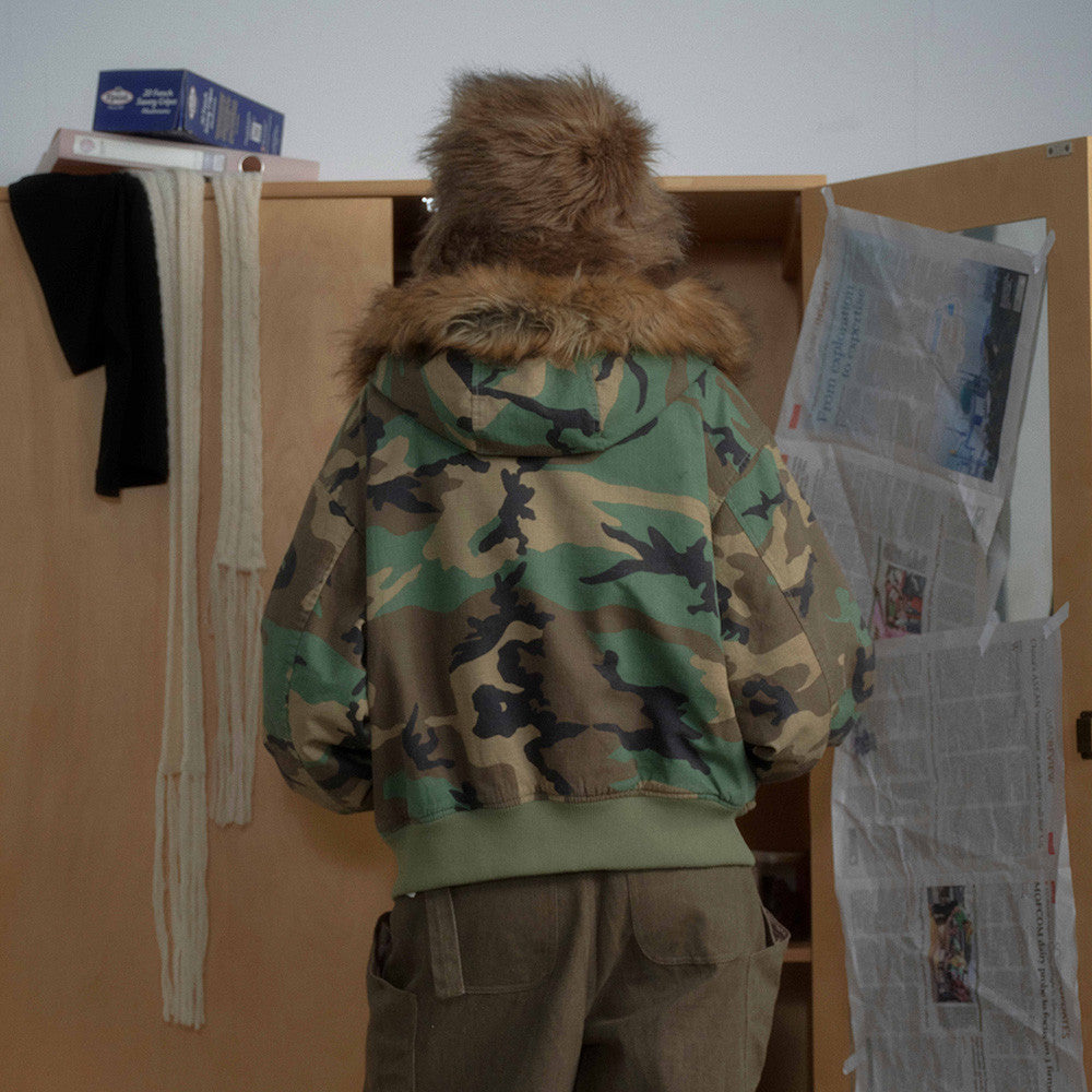 Woman wearing Camouflage Hooded Cotton Jacket in an urban setting