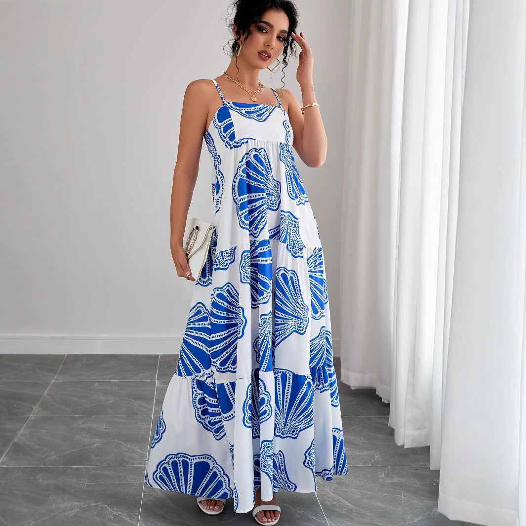 Woman wearing Printed Sleeveless Layered Maxi Dress in a sunny beach setting