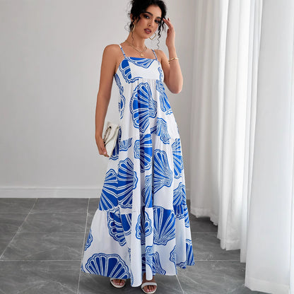 Woman wearing Printed Sleeveless Layered Maxi Dress in a sunny beach setting