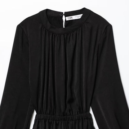 Woman wearing Black Long Sleeve A-Line Dress in a casual setting
