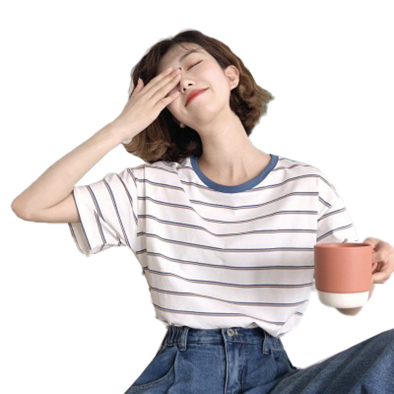 Woman wearing Academy Style Loose Fit Striped T-Shirt in a casual setting