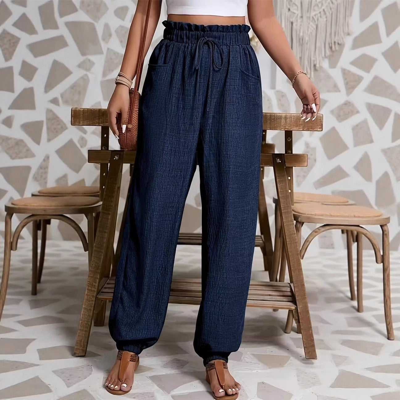 Woman wearing Elastic Solid Color Pants in a casual setting