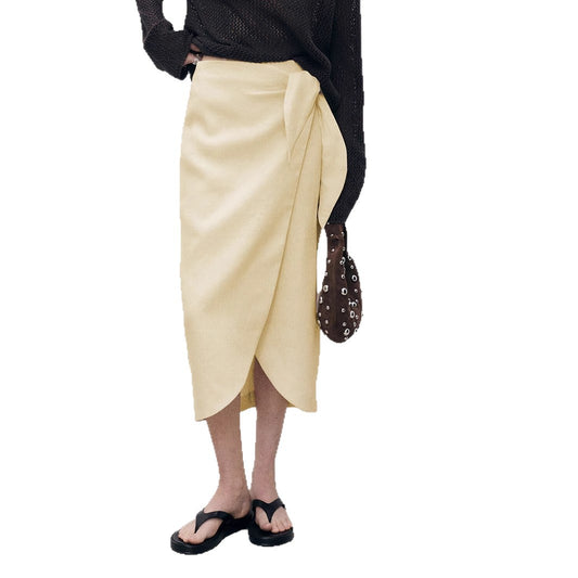 Woman wearing Solid Color Irregular Skirt in a stylish setting