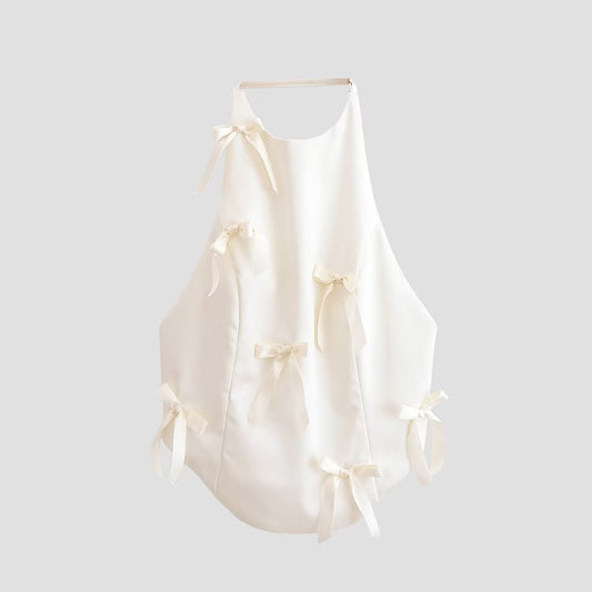 Woman wearing Spicy Girl Bow Decoration Halter Neck Top in a sunny outdoor setting