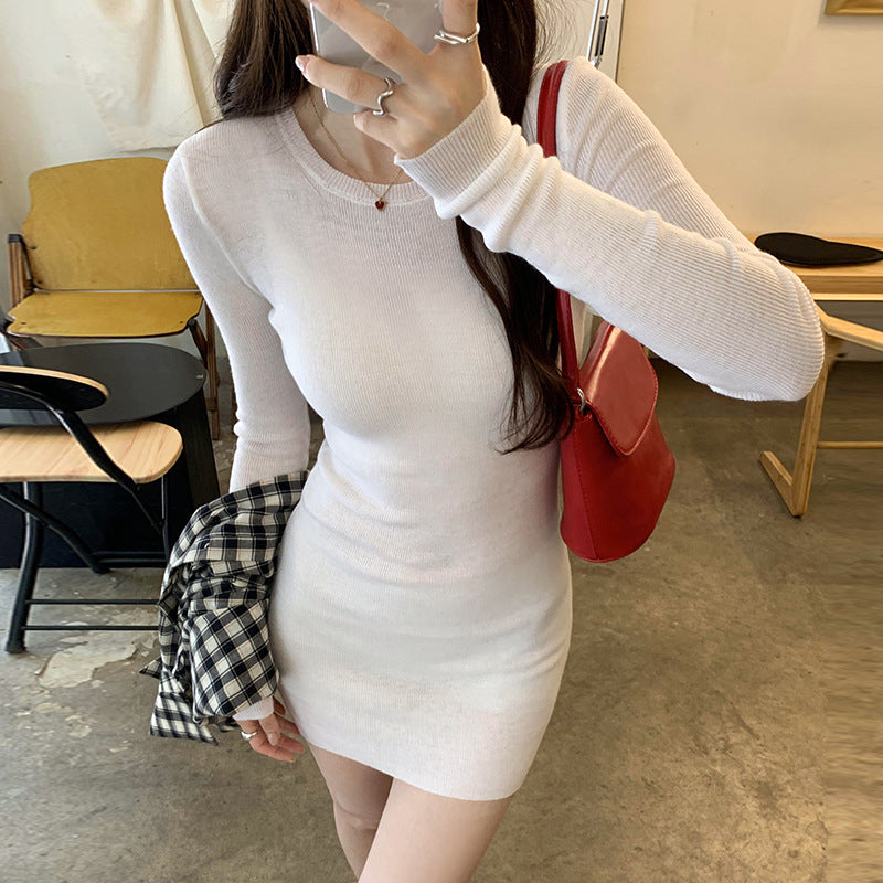 Woman wearing Slim Fit Wool Blend Long Sleeve Sweater in a cozy setting