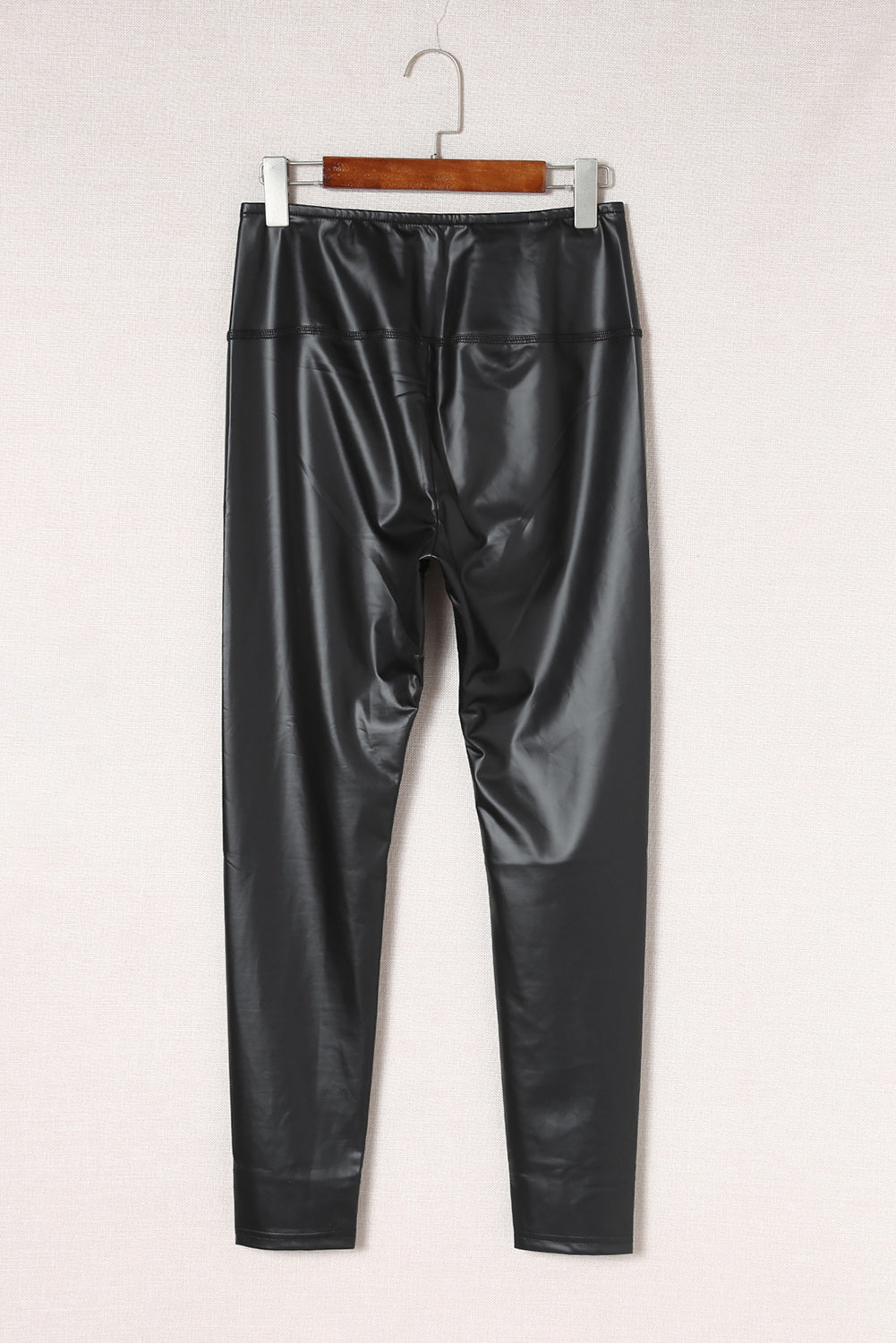 Woman wearing Black Faux Leather High Waist Leggings in a trendy urban setting
