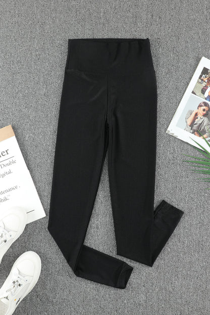 Woman wearing Black High Rise Tight Leggings in a casual setting