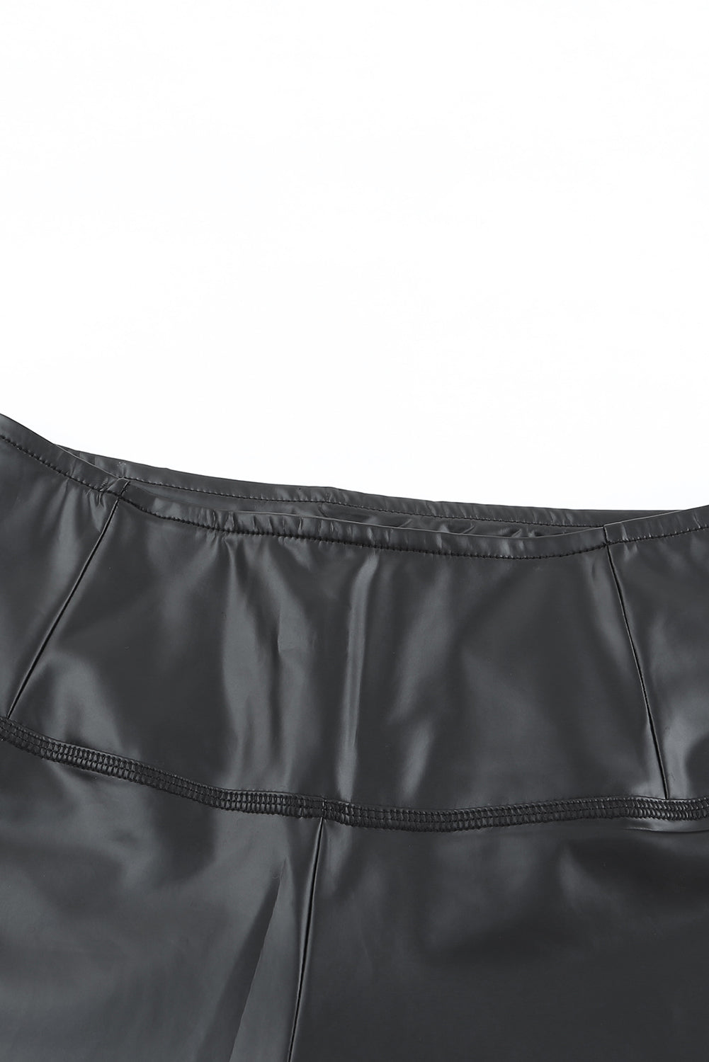 Woman wearing Black Faux Leather High Waist Leggings in a trendy urban setting